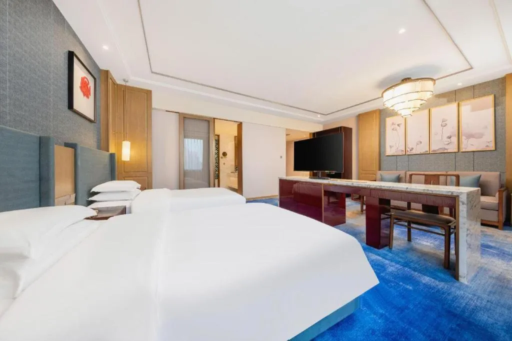 Bed in Bliss International Hotel Weihai