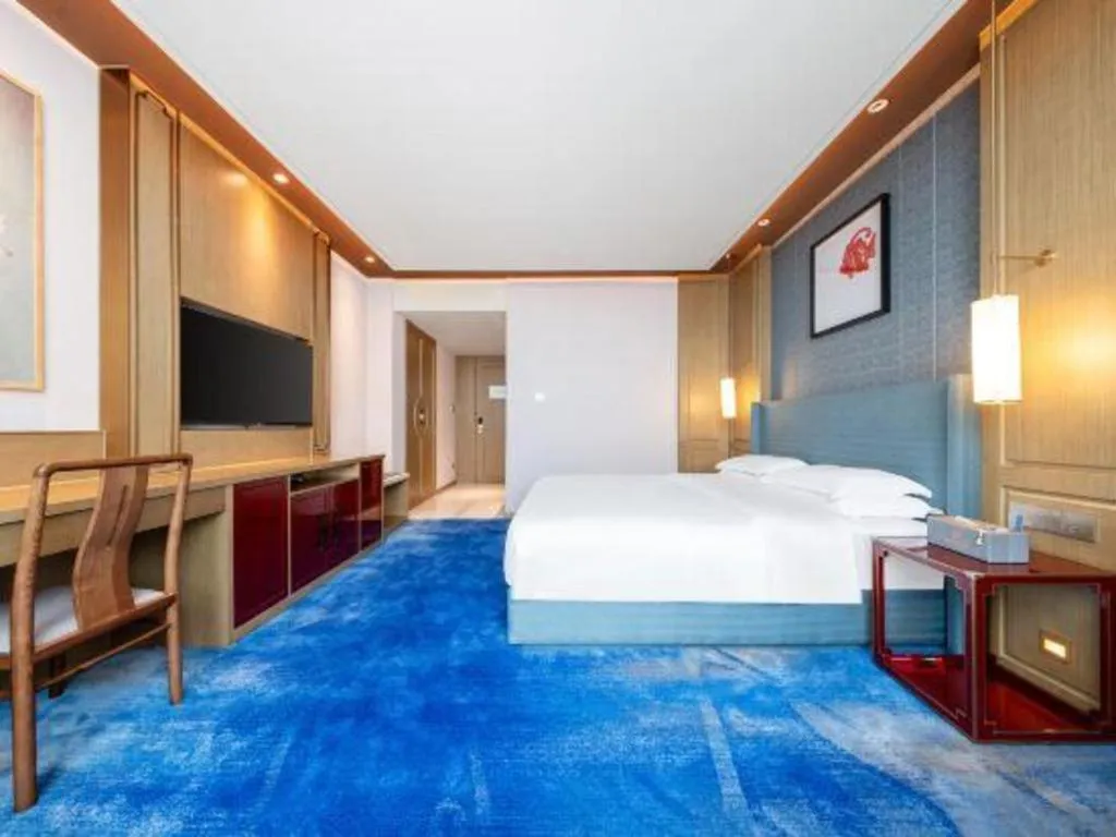 Bed in Bliss International Hotel Weihai