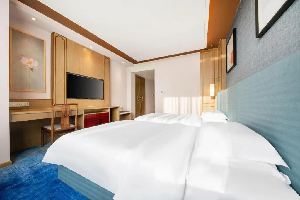 Bed in Bliss International Hotel Weihai
