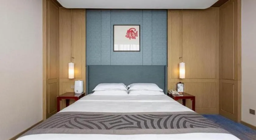 Bed in Bliss International Hotel Weihai