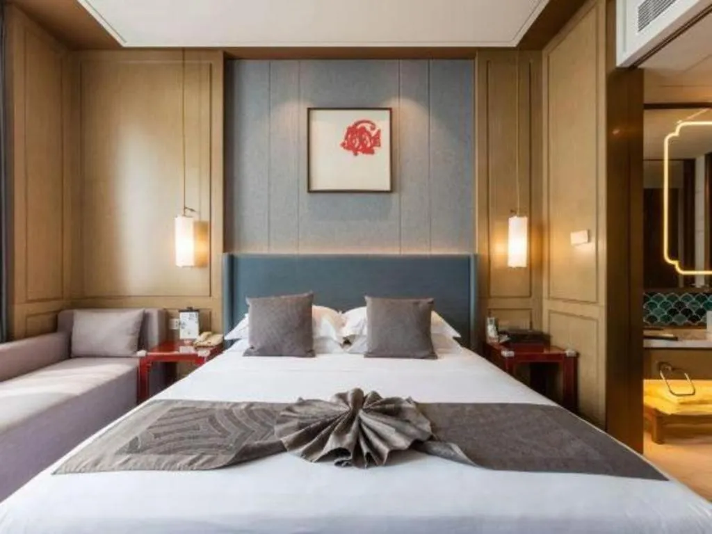 Bed in Bliss International Hotel Weihai