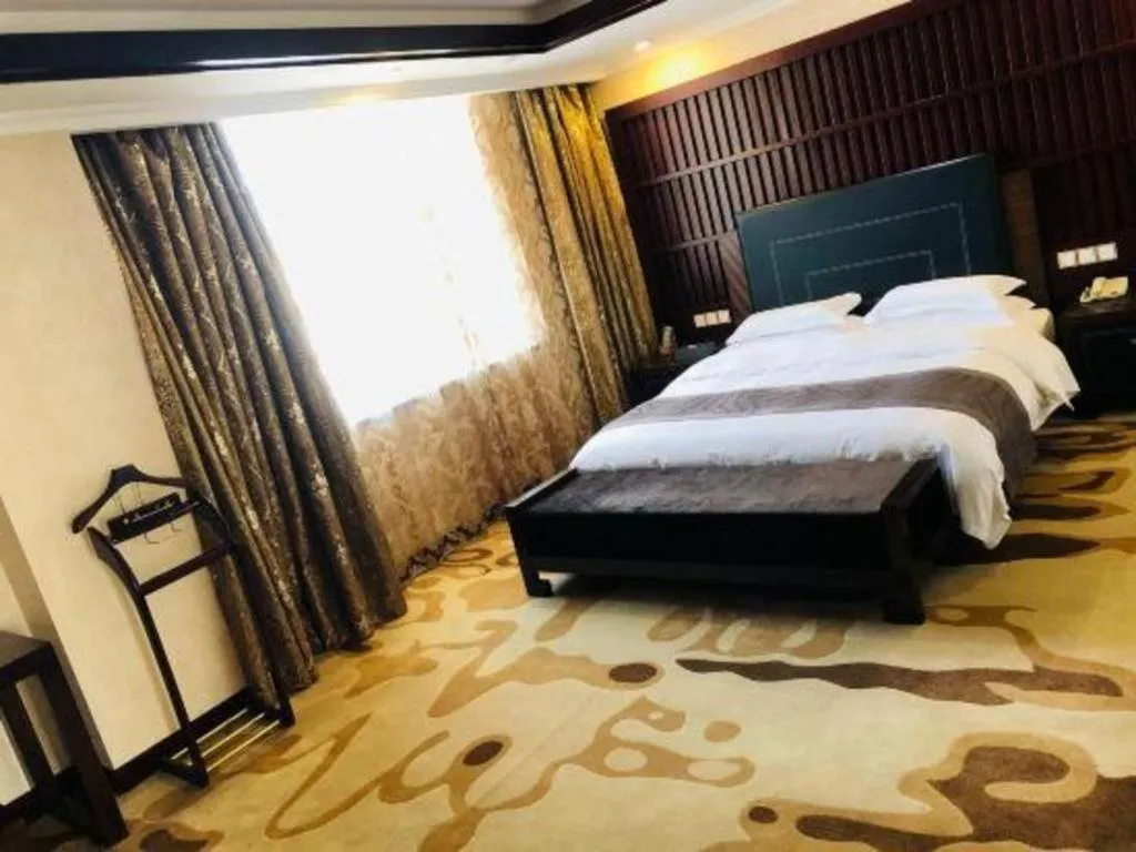 Bed in Bliss International Hotel Weihai