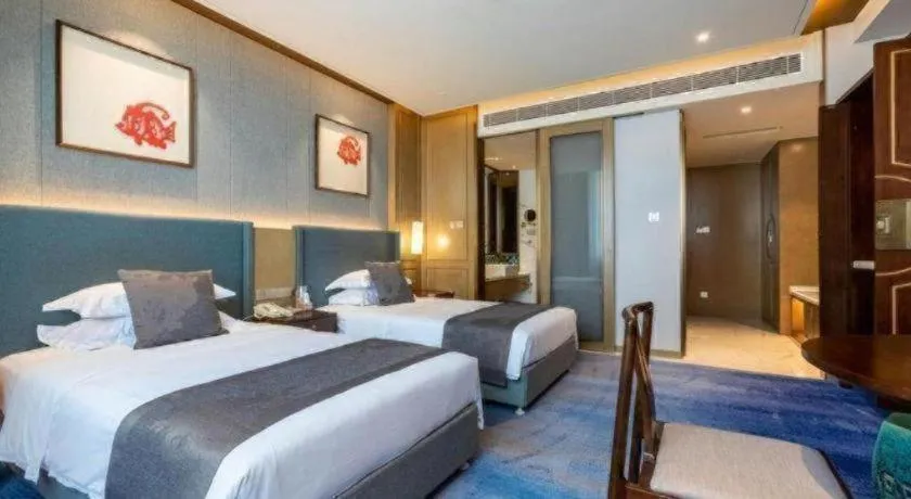 Bed in Bliss International Hotel Weihai