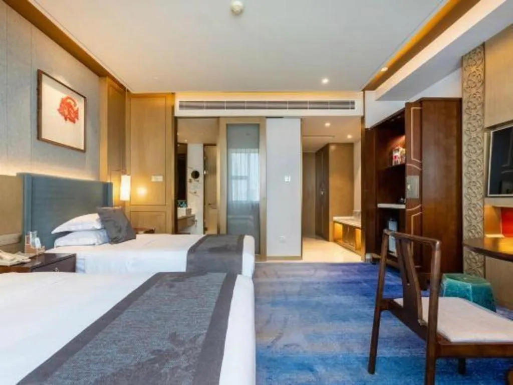 Bed in Bliss International Hotel Weihai
