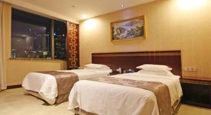 Bed in Bliss International Hotel Weihai