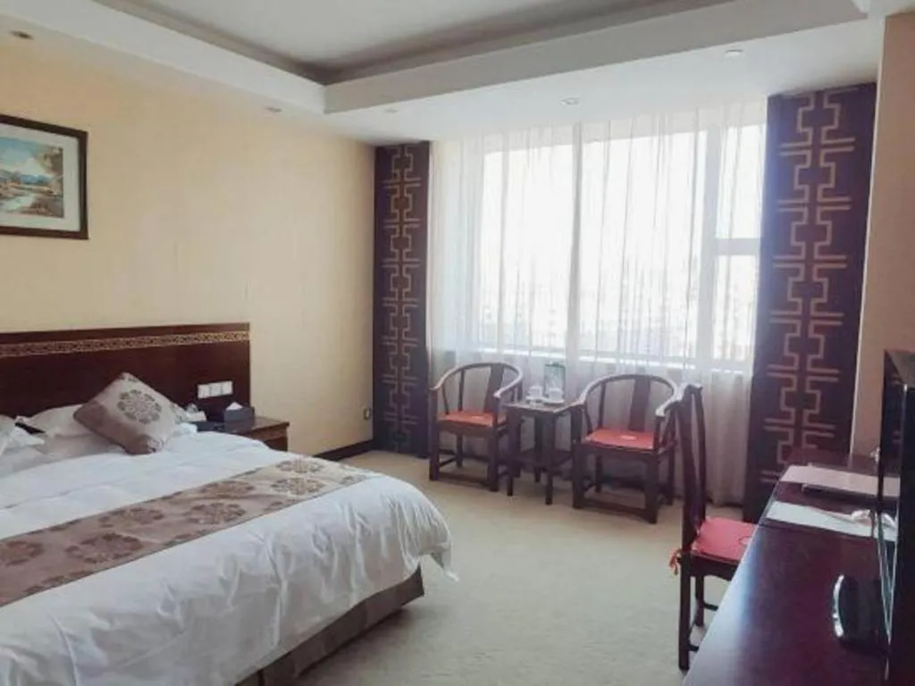 Bed in Bliss International Hotel Weihai