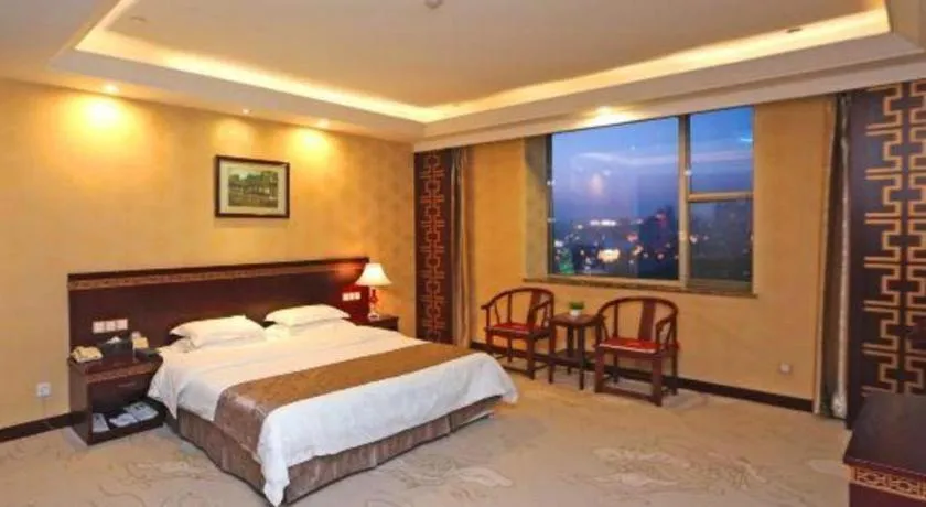 Bed in Bliss International Hotel Weihai
