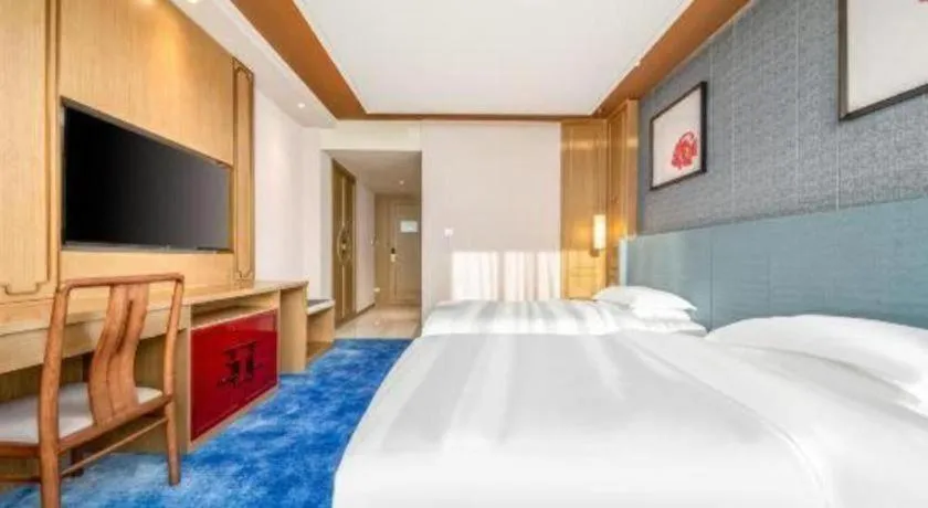 Bed in Bliss International Hotel Weihai