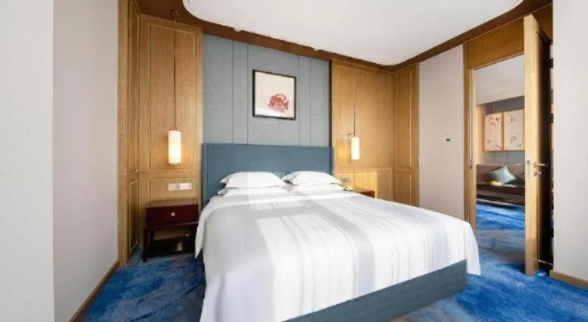 Bed in Bliss International Hotel Weihai