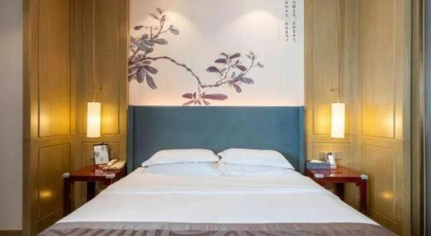 Bed in Bliss International Hotel Weihai