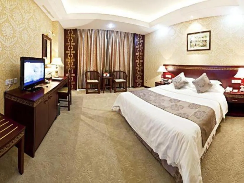 Bed in Bliss International Hotel Weihai