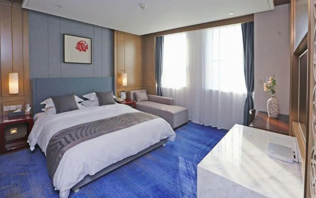 Bed in Bliss International Hotel Weihai