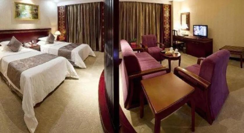 Bed in Bliss International Hotel Weihai