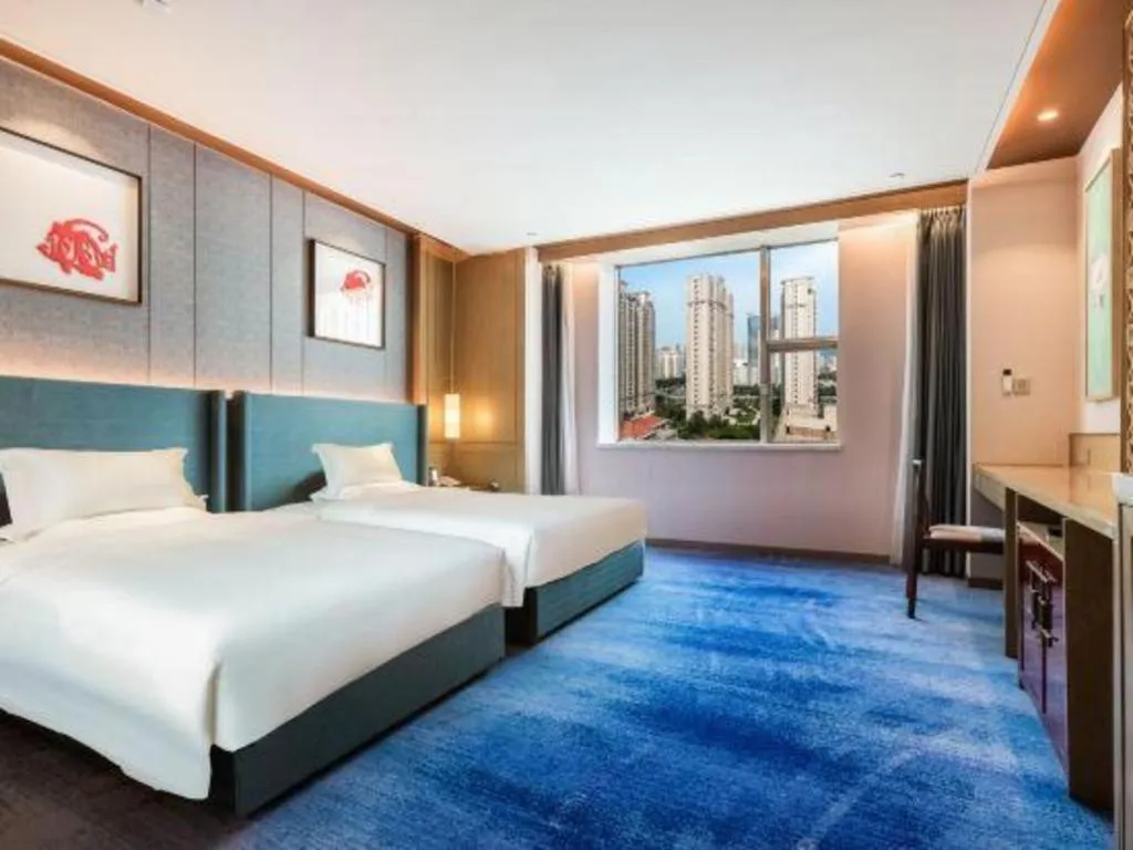 Bed in Bliss International Hotel Weihai