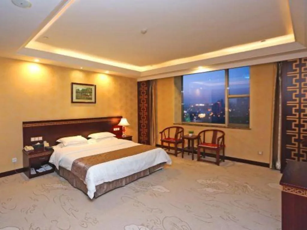 Bed in Bliss International Hotel Weihai