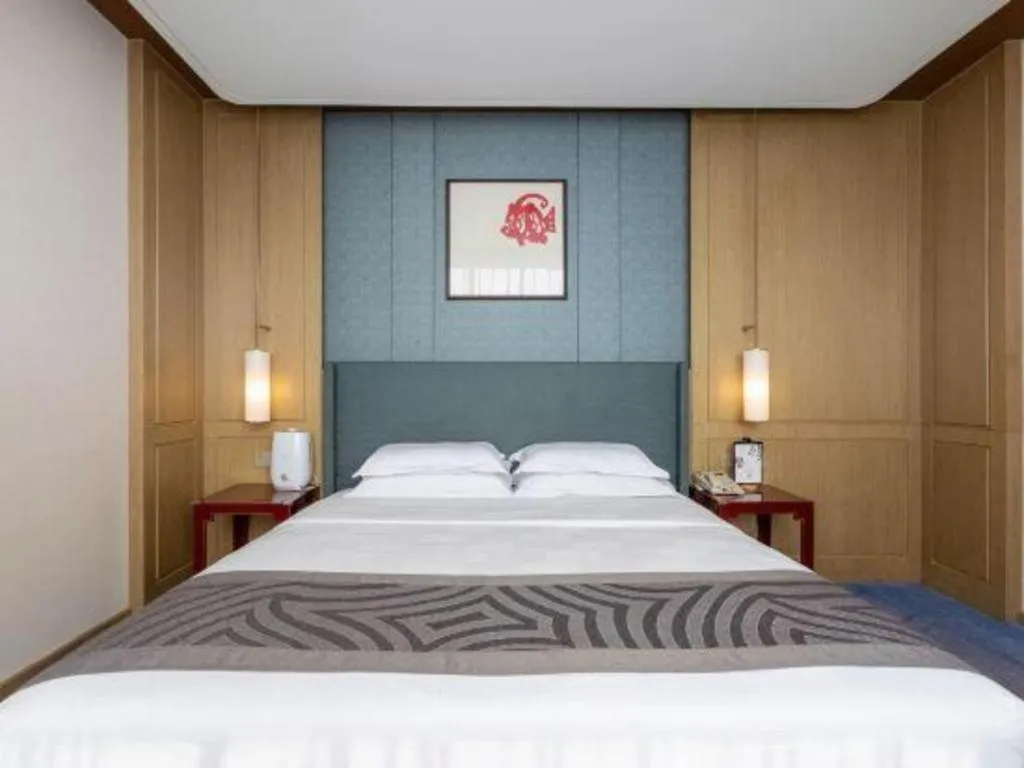 Bed in Bliss International Hotel Weihai