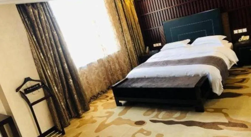 Bed in Bliss International Hotel Weihai