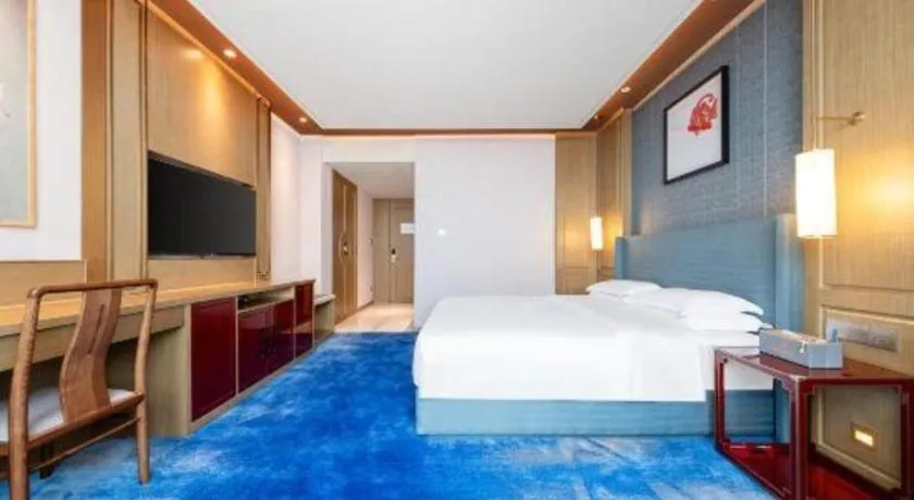 Bed in Bliss International Hotel Weihai