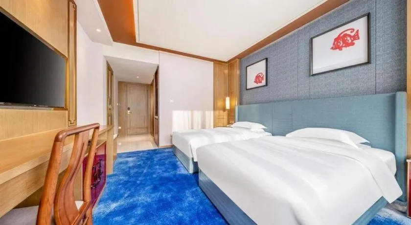 Bed in Bliss International Hotel Weihai