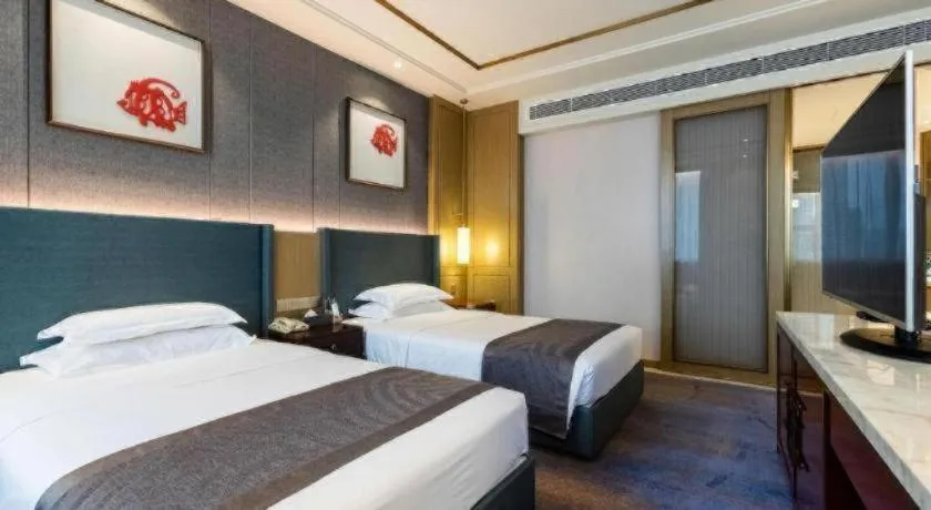 Bed in Bliss International Hotel Weihai