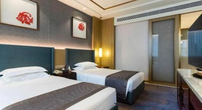 Bed in Bliss International Hotel Weihai