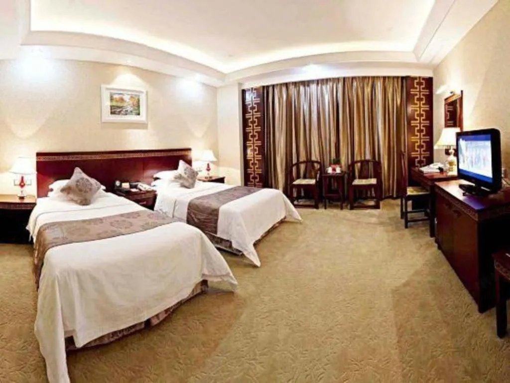 Bed in Bliss International Hotel Weihai