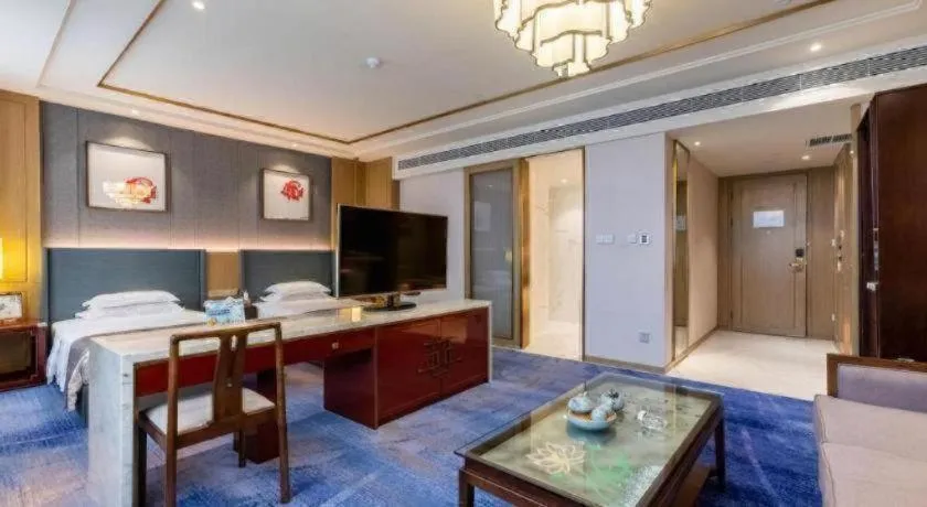 Bed in Bliss International Hotel Weihai