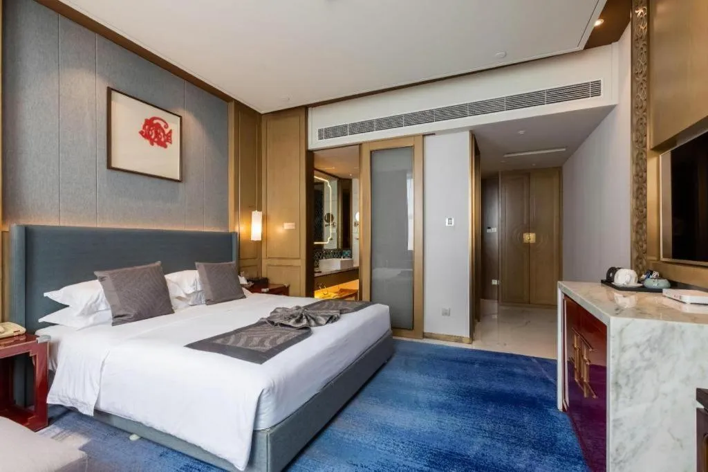 Bed in Bliss International Hotel Weihai