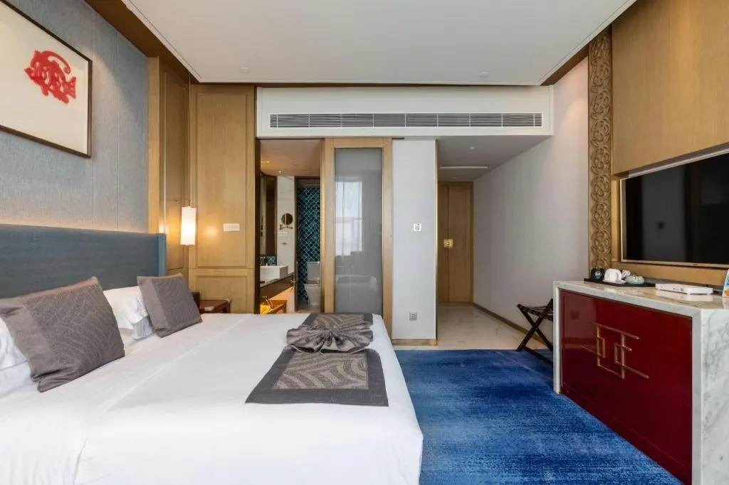 Bed in Bliss International Hotel Weihai