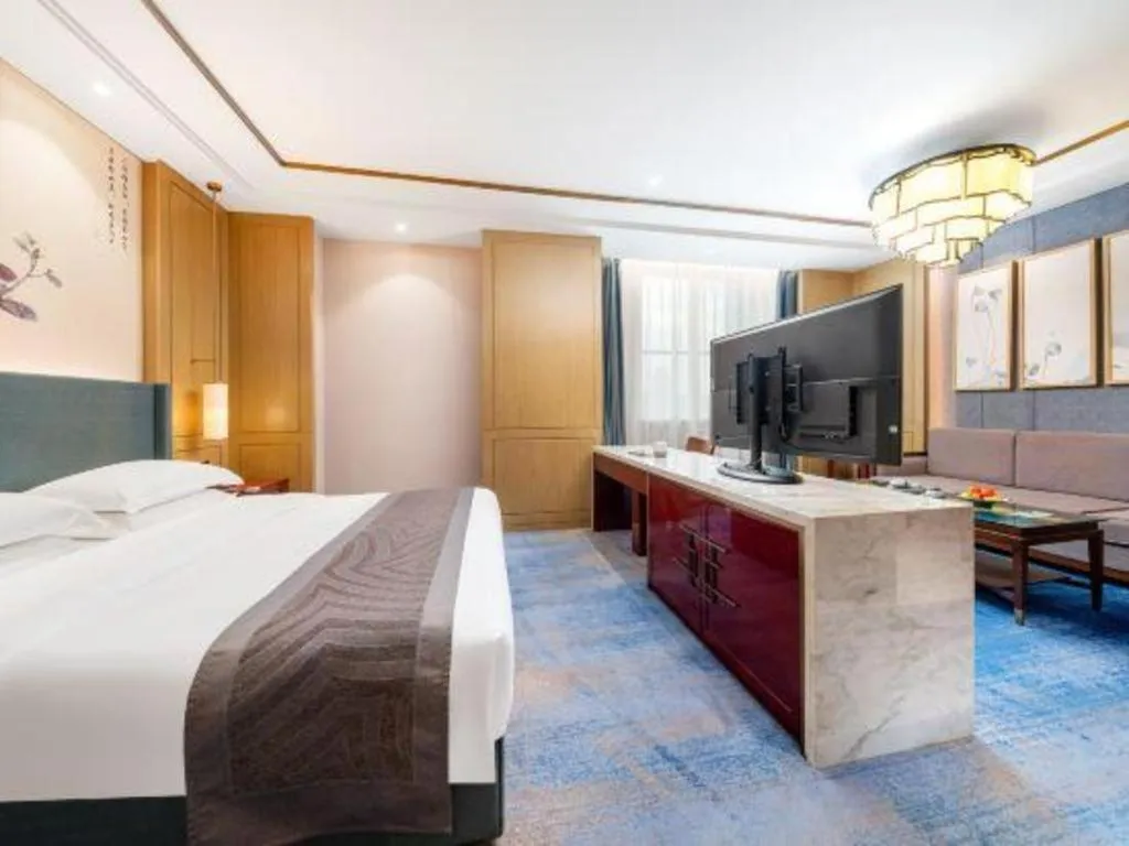 Bed in Bliss International Hotel Weihai