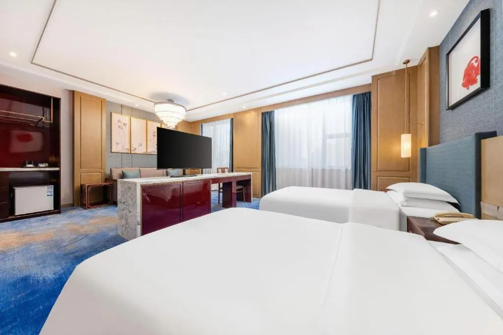 Bed in Bliss International Hotel Weihai