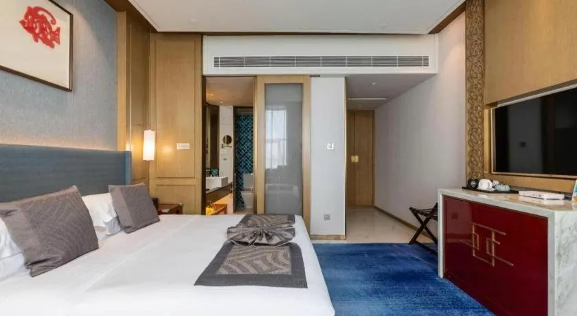 Bed in Bliss International Hotel Weihai