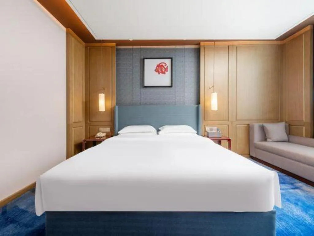 Bed in Bliss International Hotel Weihai