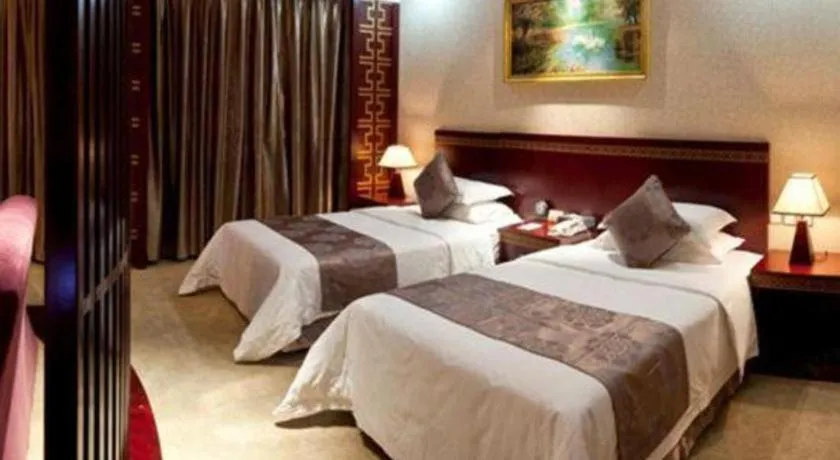 Bed in Bliss International Hotel Weihai