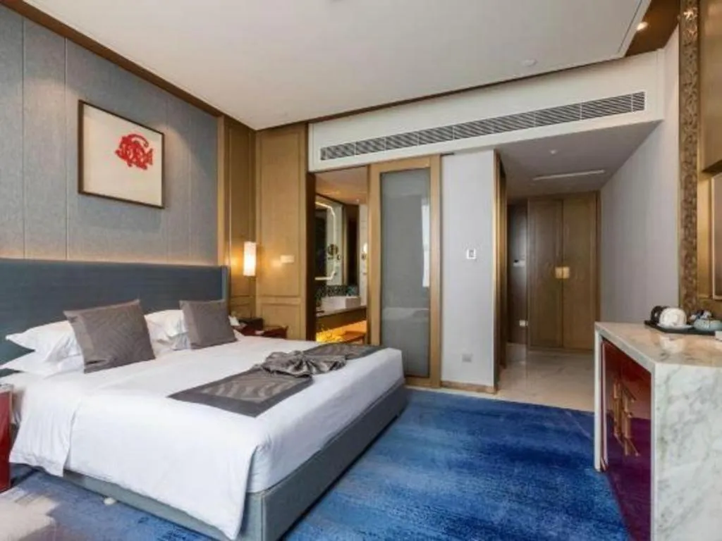 Bed in Bliss International Hotel Weihai