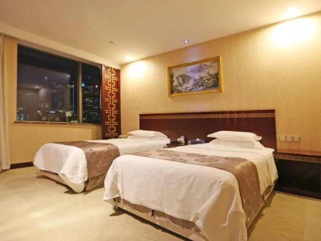 Bed in Bliss International Hotel Weihai