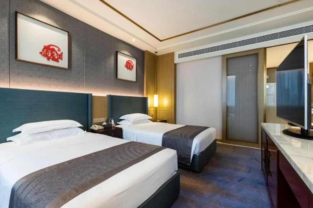 Bed in Bliss International Hotel Weihai