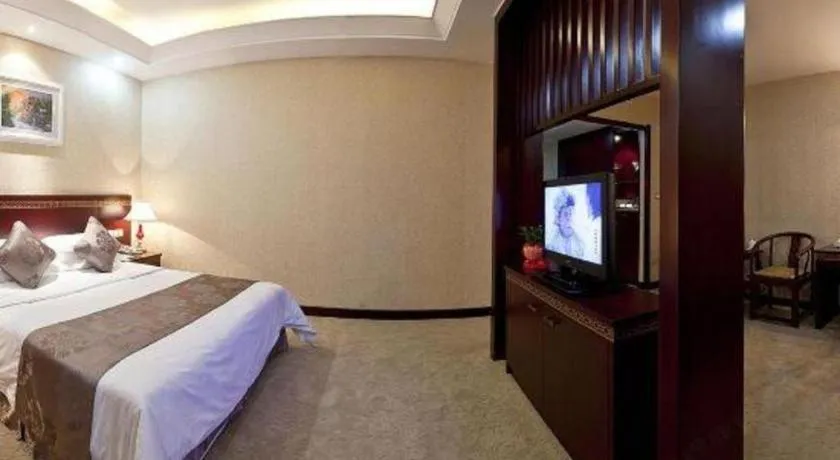 Bed in Bliss International Hotel Weihai