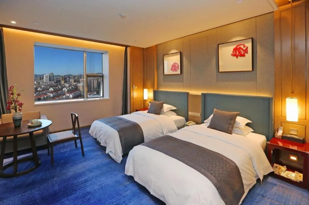 Bed in Bliss International Hotel Weihai