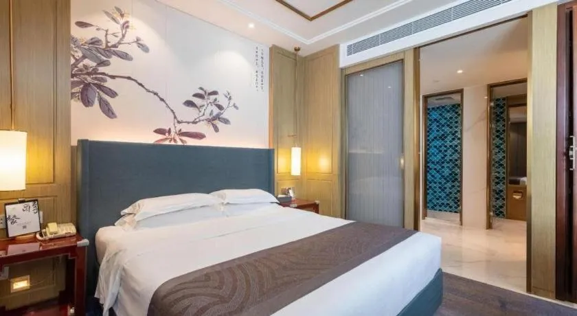 Bed in Bliss International Hotel Weihai