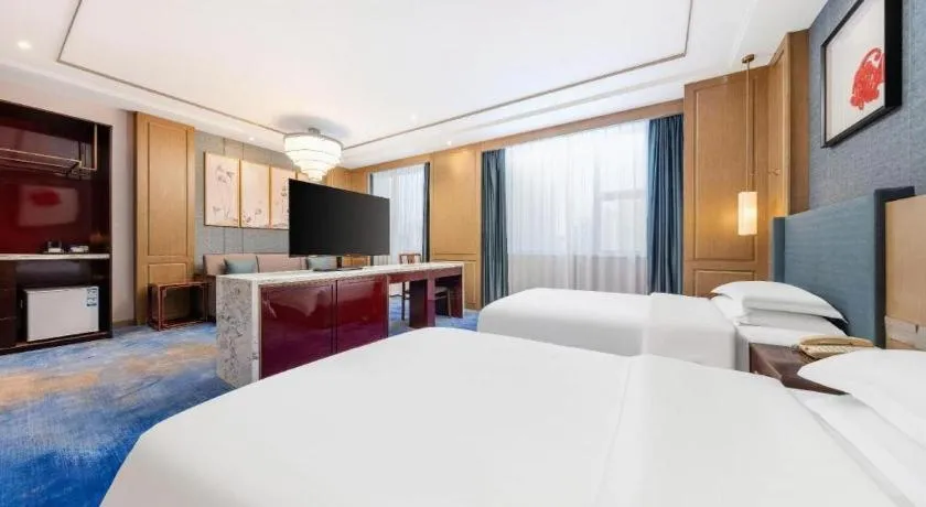 Bed in Bliss International Hotel Weihai