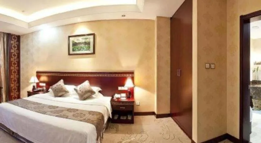 Bed in Bliss International Hotel Weihai