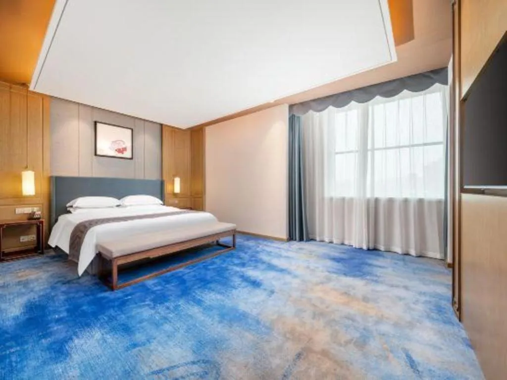 Bed in Bliss International Hotel Weihai
