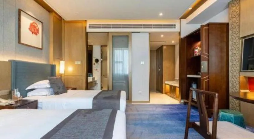 Bed in Bliss International Hotel Weihai