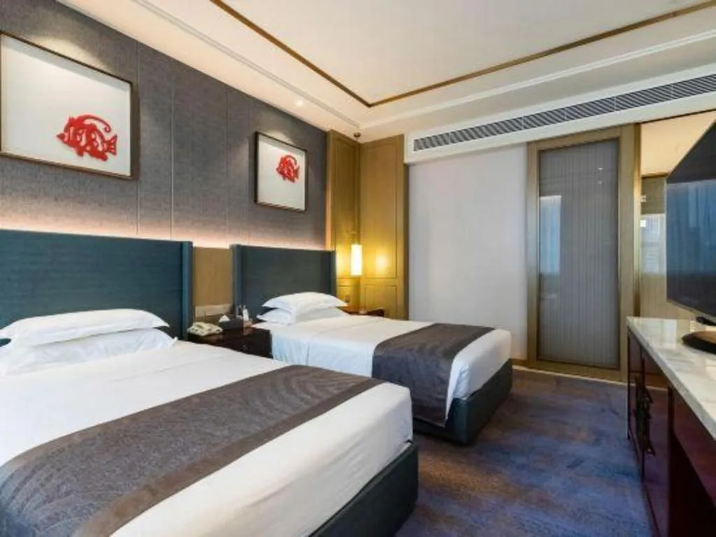 Bed in Bliss International Hotel Weihai