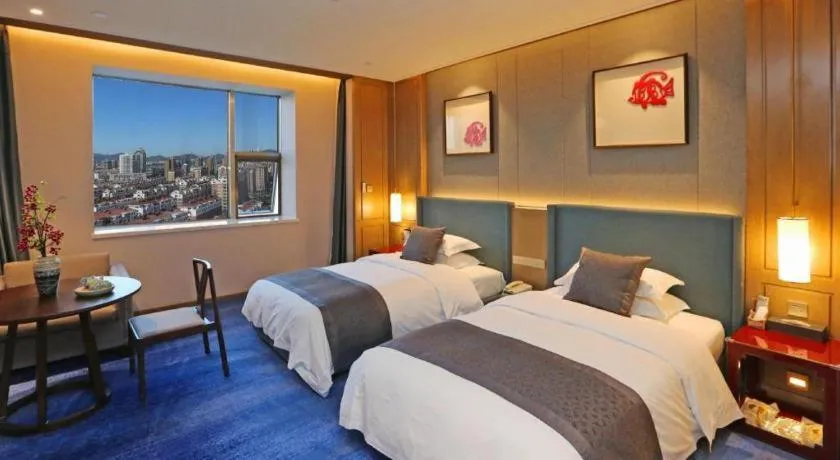 Bed in Bliss International Hotel Weihai