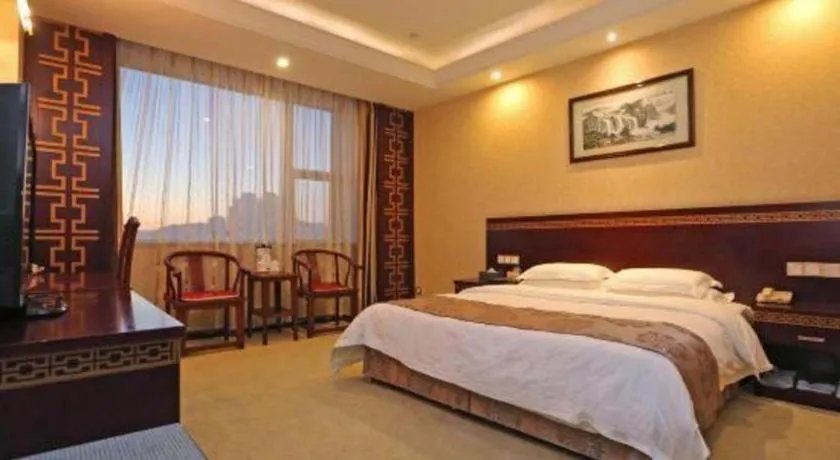 Bed in Bliss International Hotel Weihai
