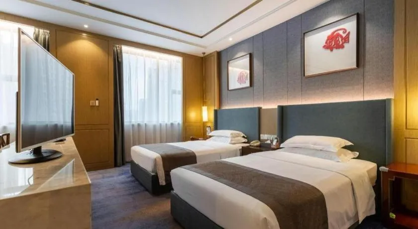 Bed in Bliss International Hotel Weihai