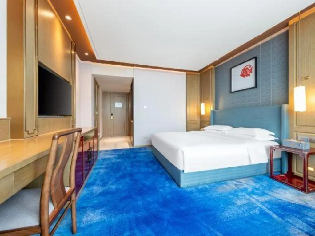 Bed in Bliss International Hotel Weihai