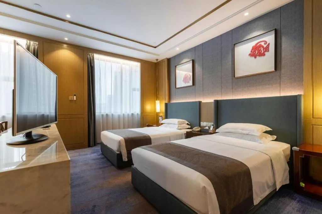 Bed in Bliss International Hotel Weihai